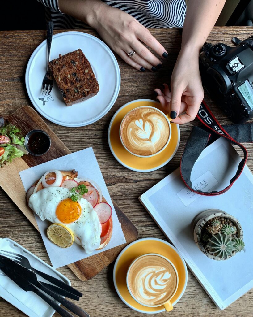 Delicious breakfast with eggs and coffee on rustic wooden table. Perfect for food lovers.